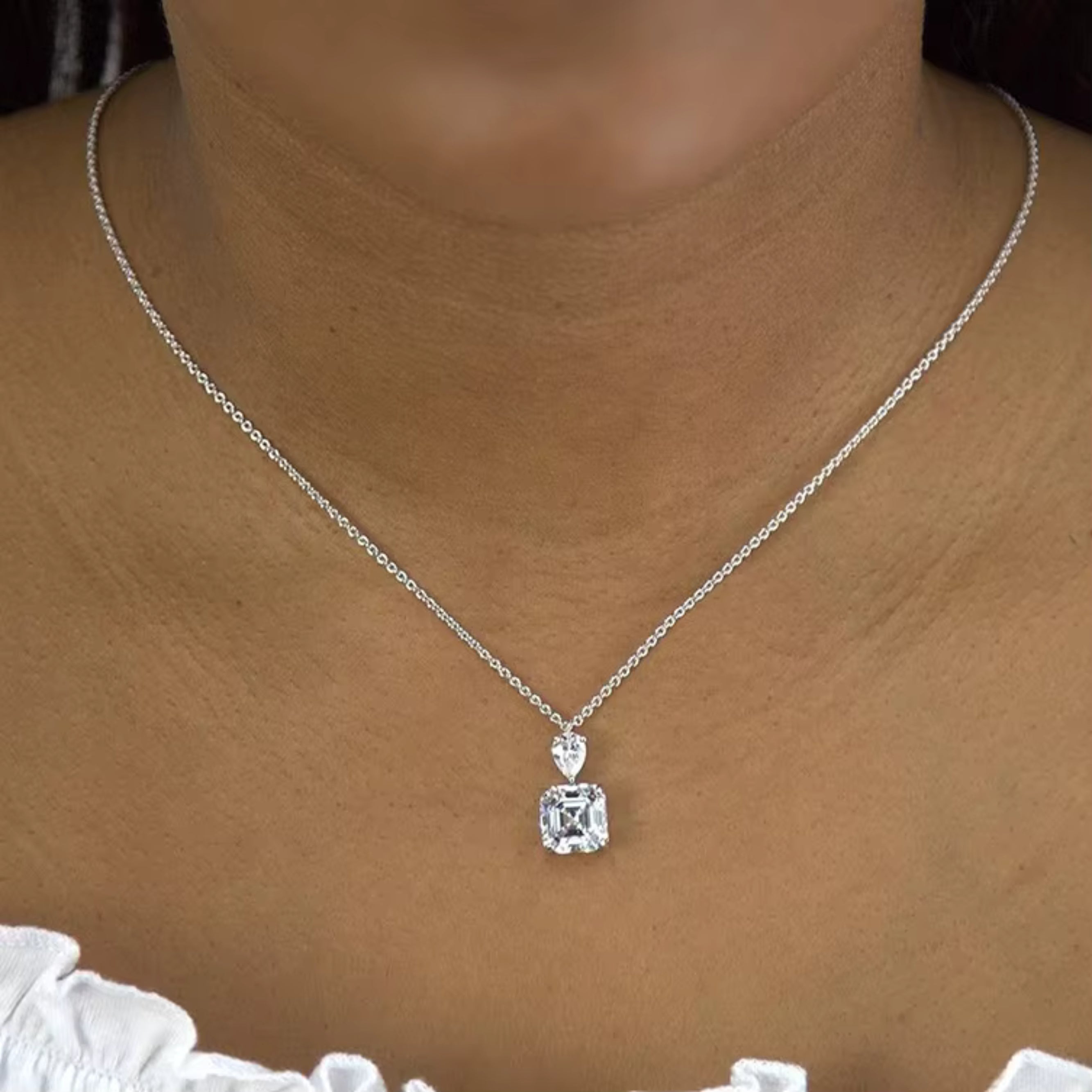 1.2ct.tw Pear & Asscher Moissanite Sterling Silver Pendant Necklace Moissanite